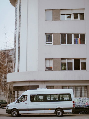 white-van-parking-near-building.jpg white van parking near building